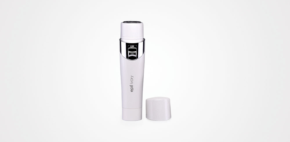 White skincare bottle with black cap on a light gray background